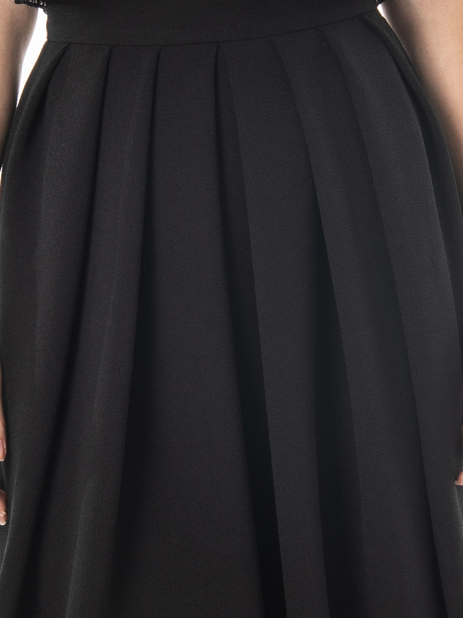Black pleated skirt detail • Sassa Björg