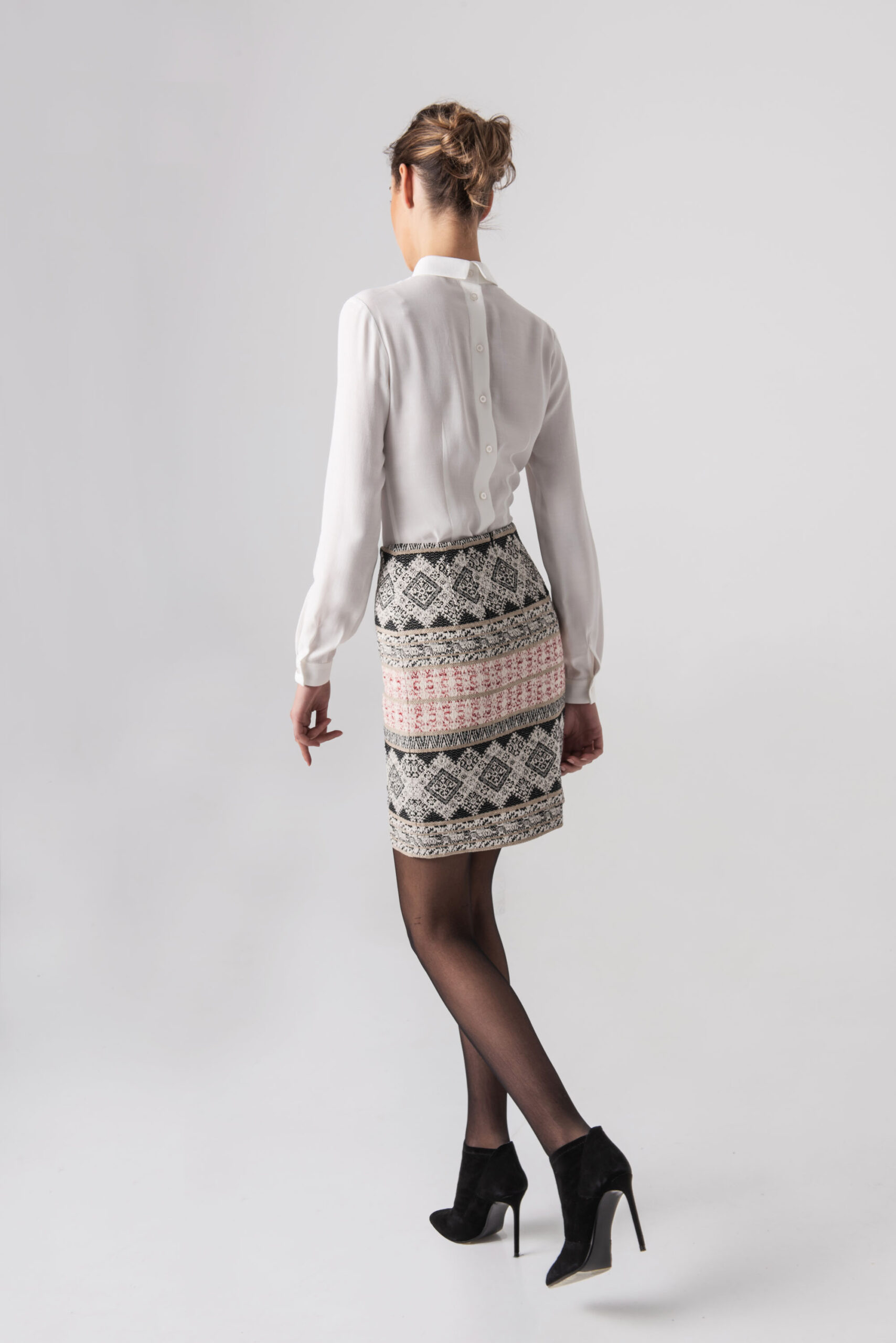 Straight mini skirt with etno motif walking scaled • Sassa Björg