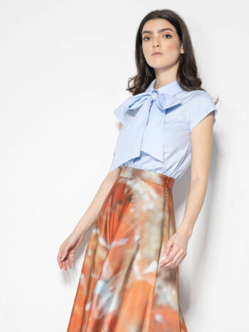 light blue shirt w exaggerated bow crop tied • Sassa Björg