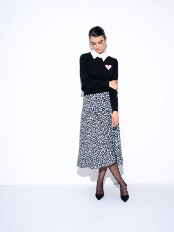 hearty sweater black legs crossed • Sassa Björg