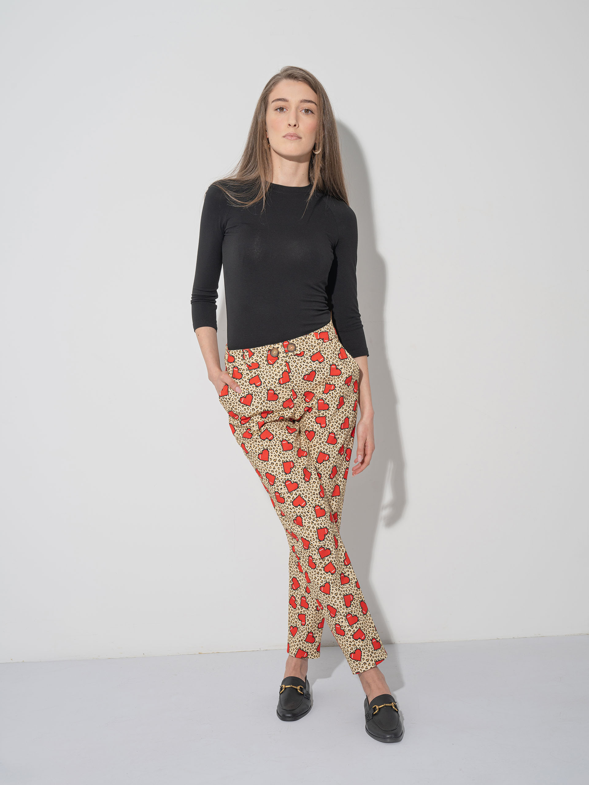 pixelated hearts pants croseed legs • Sassa Björg